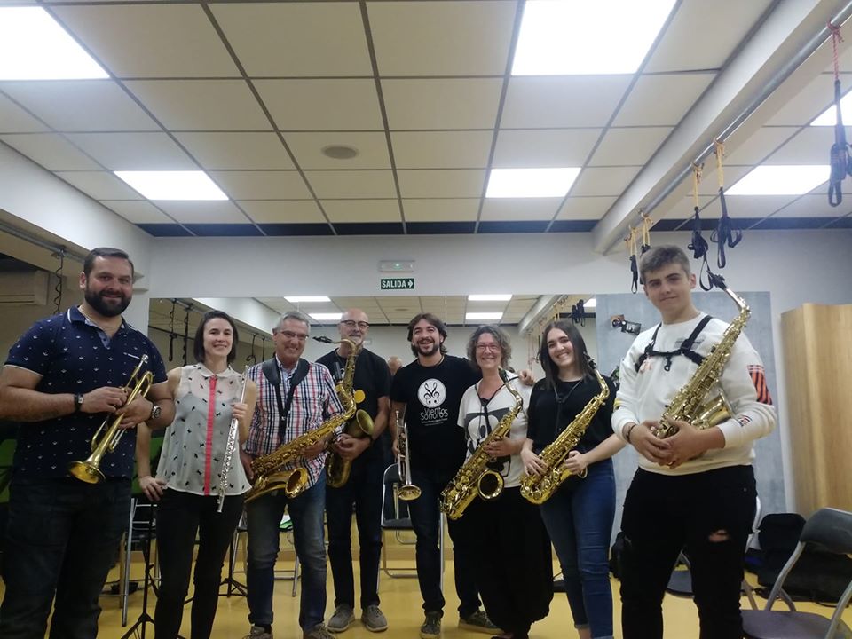 a group of people holding musical instruments