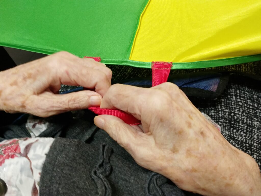 a close up of hands sewing