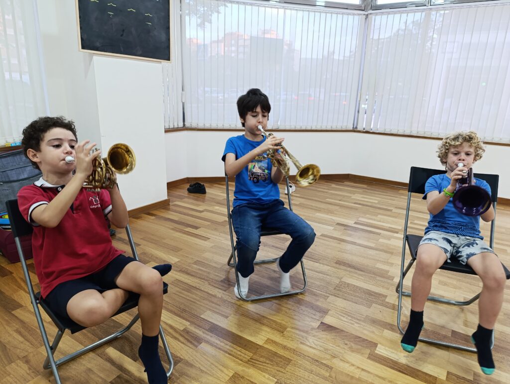 a group of kids playing instruments