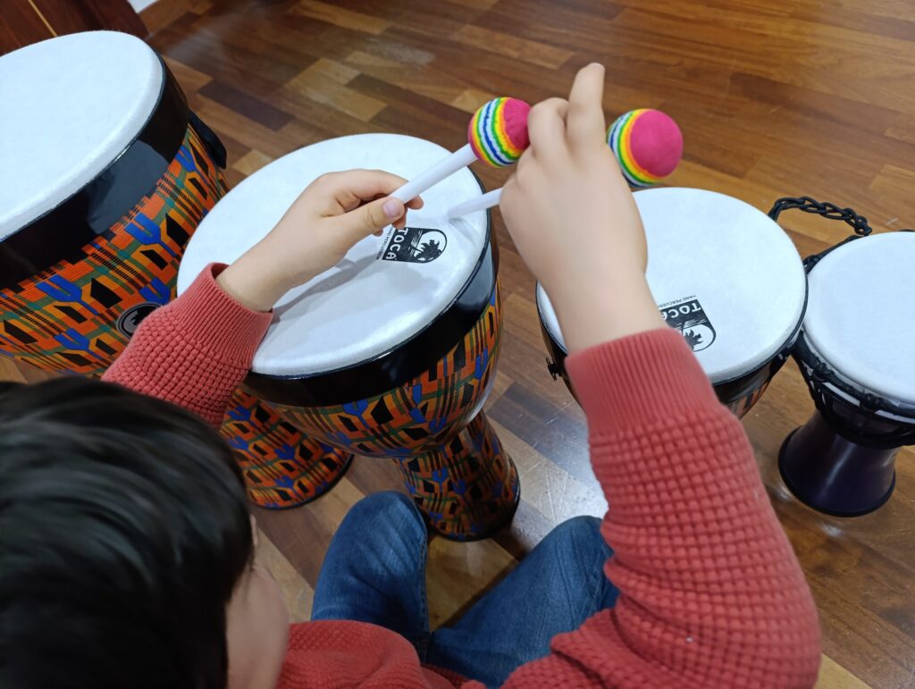 a person playing drums with sticks