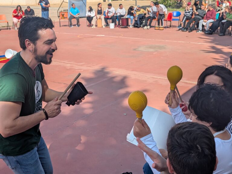 a group of people playing maracas